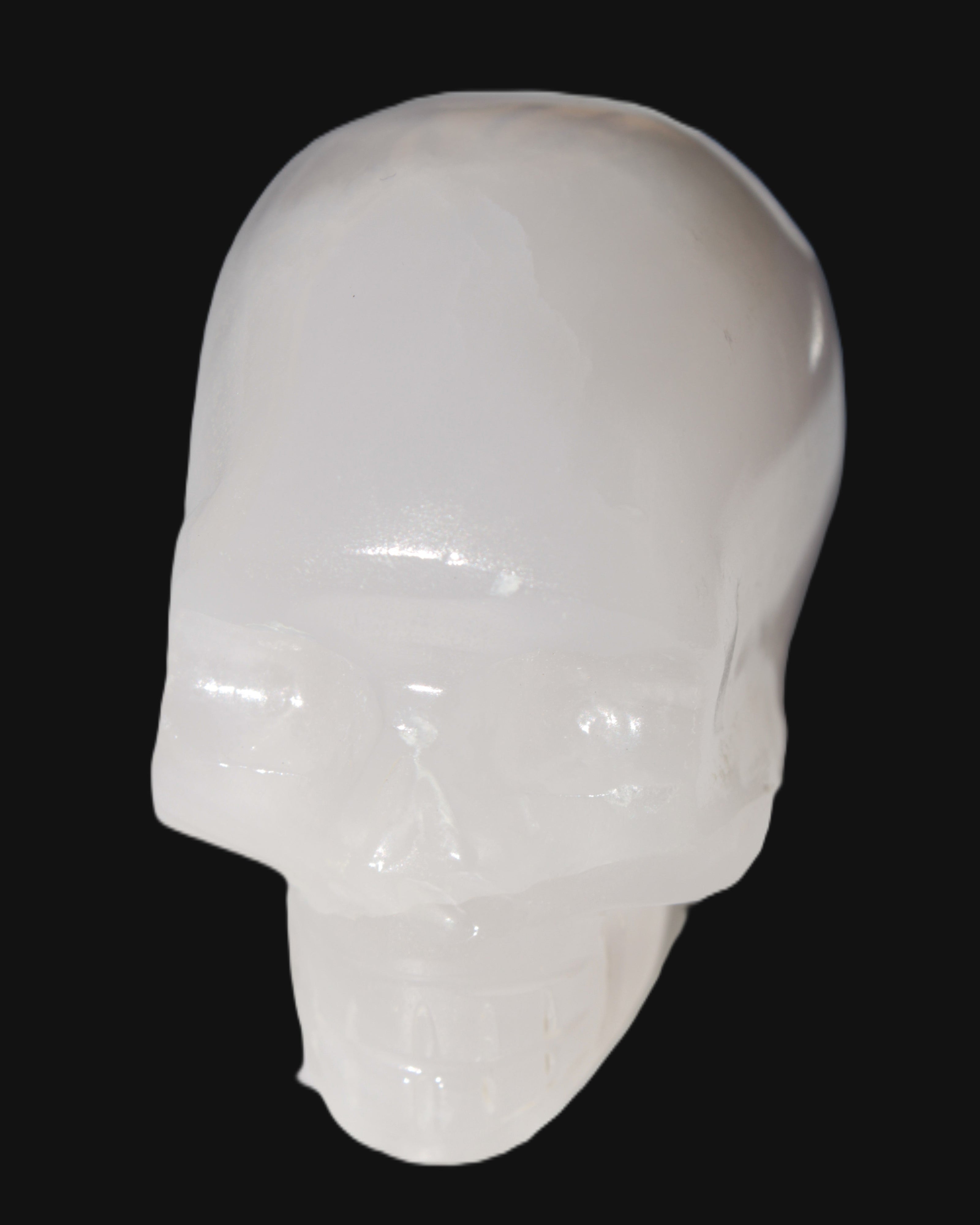 Mangano Calcite skull 40*55*45mm  160/161g in sunlight - Rocks and Things Store