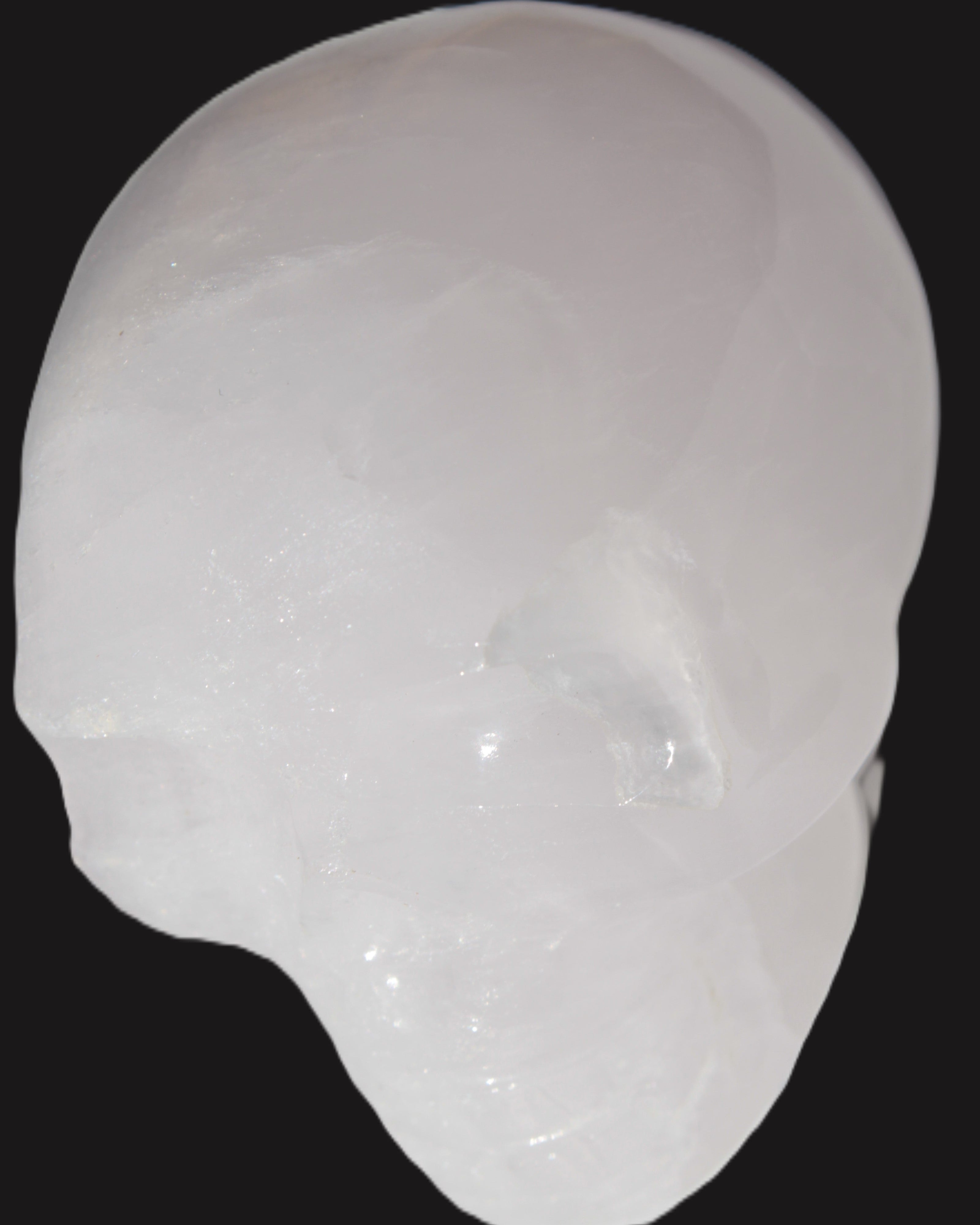 Mangano Calcite skull 40*55*45mm  160/161g in sunlight - Rocks and Things Store