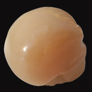 Honey Calcite skull 40*58*56mm 182-194g in sunlight - Rocks and Things Store