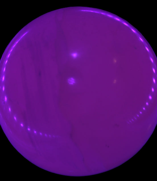 Mangano Calcite sphere 45mm 125g in UV light - Rocks and Things Store
