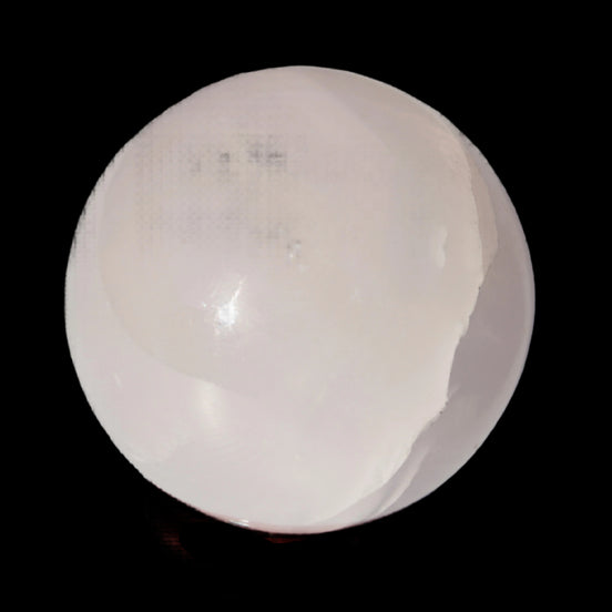 Mangano Calcite sphere 45mm 125g in sunlight - Rocks and Things Store