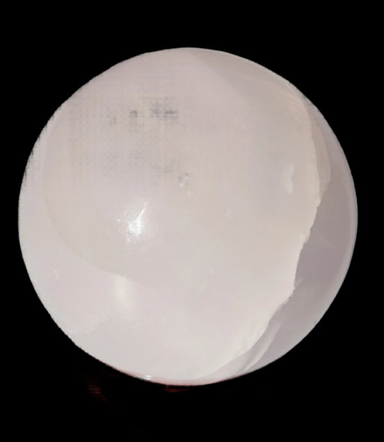 Mangano Calcite sphere 45mm 125g in sunlight - Rocks and Things Store