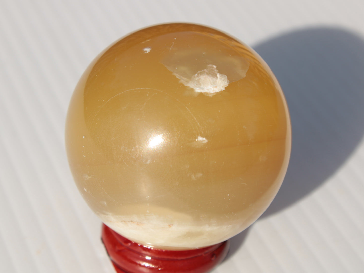 Honey Calcite sphere 47mm 162g Rocks and Things