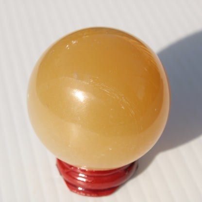 Honey Calcite sphere 47mm 162g Rocks and Things