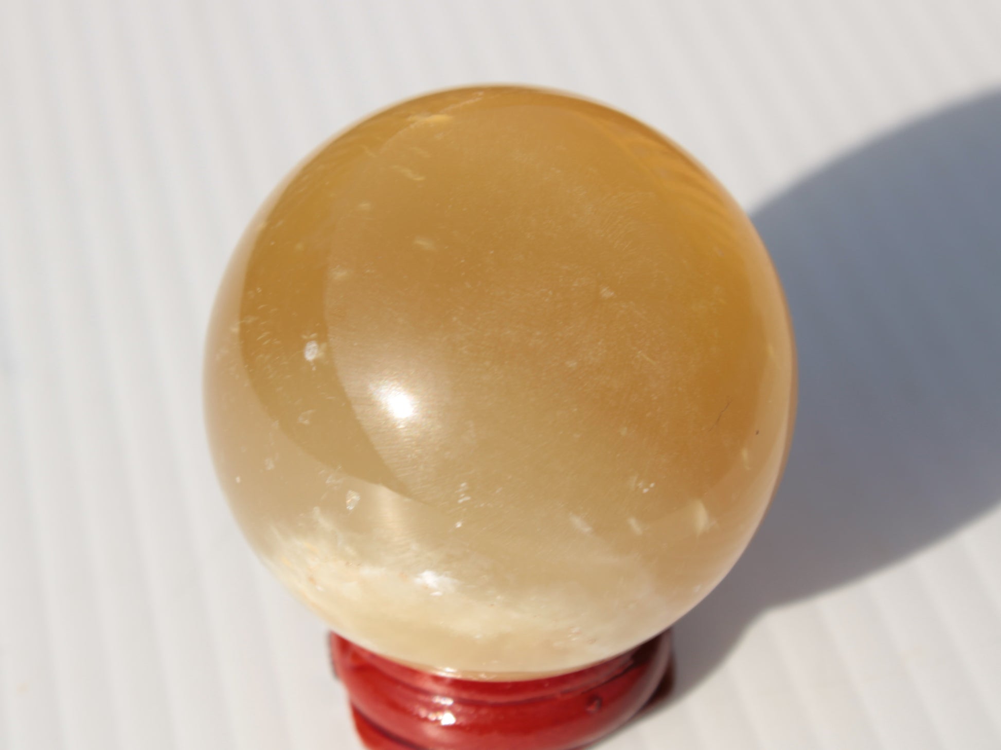 Honey Calcite sphere 47mm 162g Rocks and Things