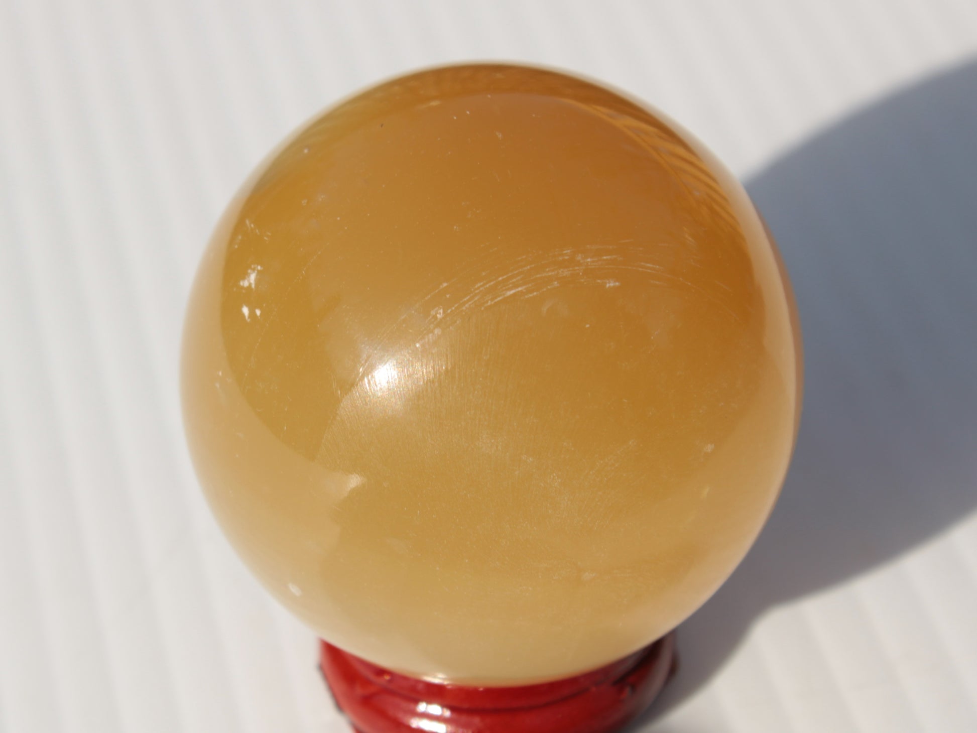 Honey Calcite sphere 47mm 162g Rocks and Things