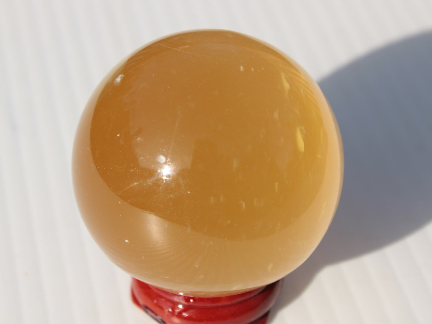 Honey Calcite sphere 47mm 162g Rocks and Things