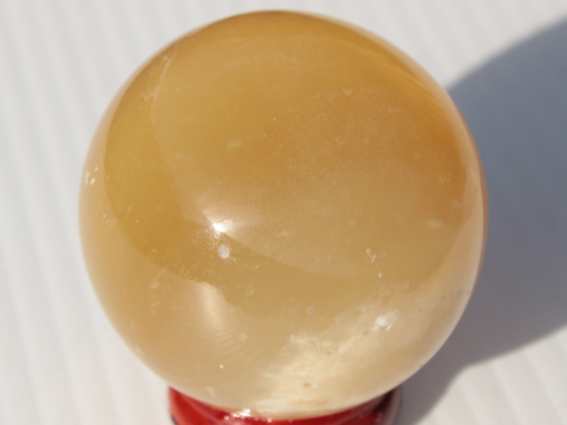 Honey Calcite sphere 47mm 162g Rocks and Things