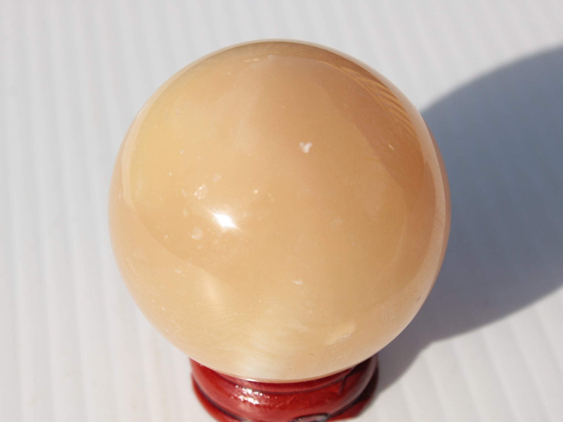 Honey Calcite sphere 49mm 167g Rocks and Things