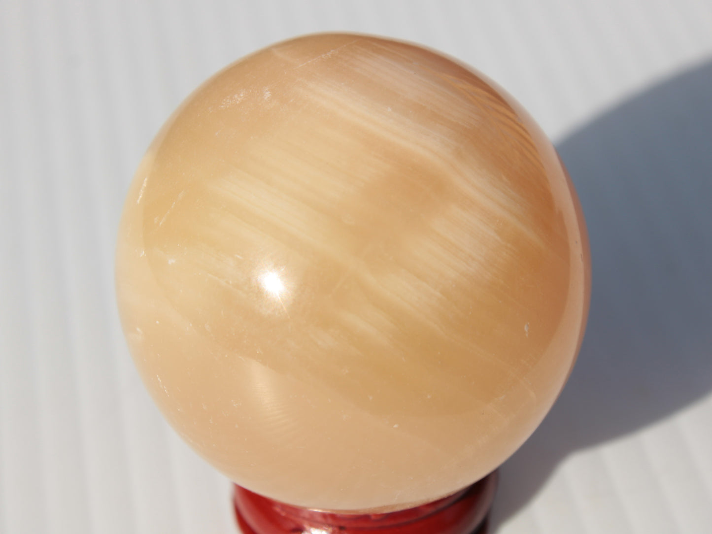 Honey Calcite sphere 49mm 167g Rocks and Things