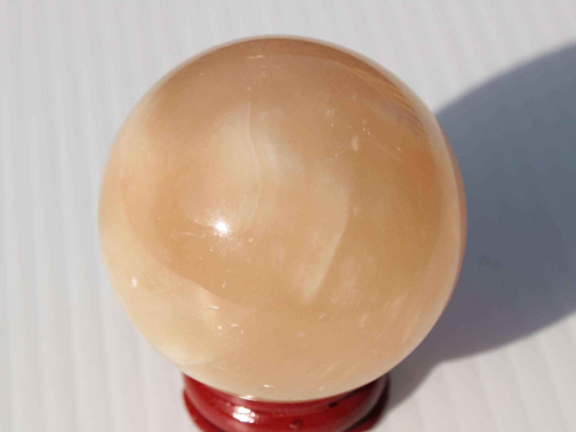 Honey Calcite sphere 49mm 167g Rocks and Things