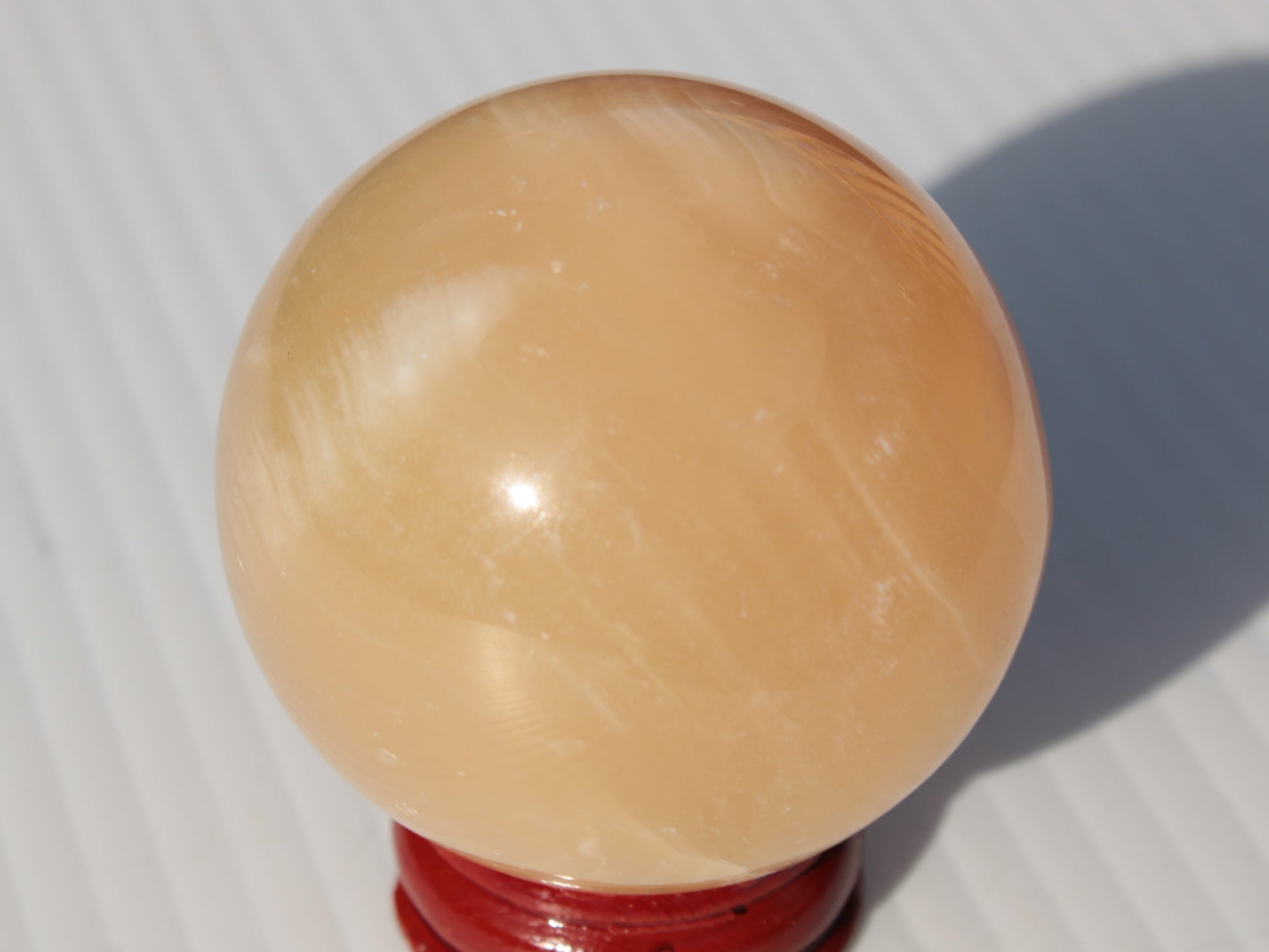 Honey Calcite sphere 49mm 167g Rocks and Things