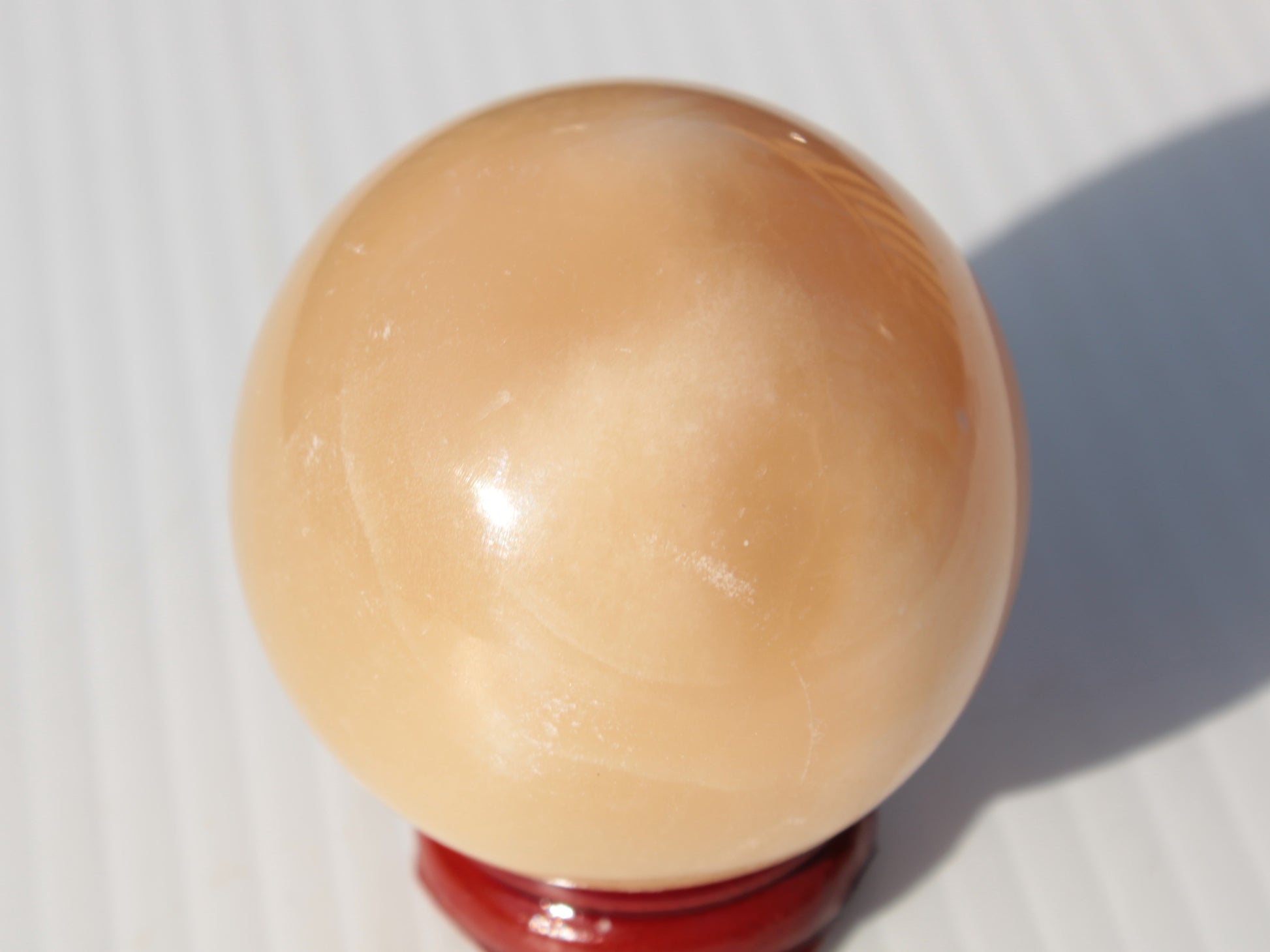 Honey Calcite sphere 49mm 167g Rocks and Things