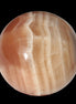 Honey Calcite sphere 55mm 177g in sunlight - Rocks and Things Store