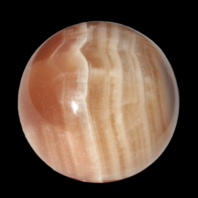 Honey Calcite sphere 55mm 177g in sunlight - Rocks and Things Store