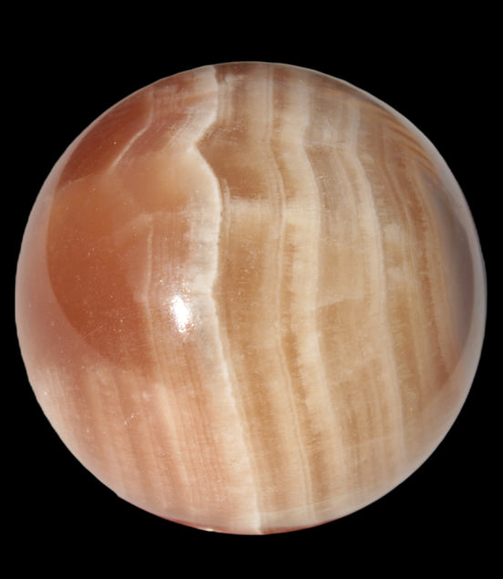 Honey Calcite sphere 55mm 177g in sunlight - Rocks and Things Store