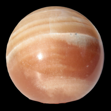 Honey Calcite sphere 55mm 177g in sunlight - Rocks and Things Store