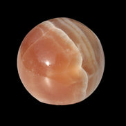 Honey Calcite sphere 55mm 177g in sunlight - Rocks and Things Store