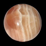 Honey Calcite sphere 55mm 177g in sunlight - Rocks and Things Store