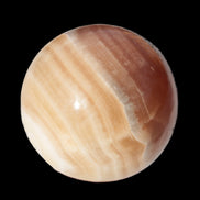 Honey Calcite sphere 55mm 177g in sunlight - Rocks and Things Store