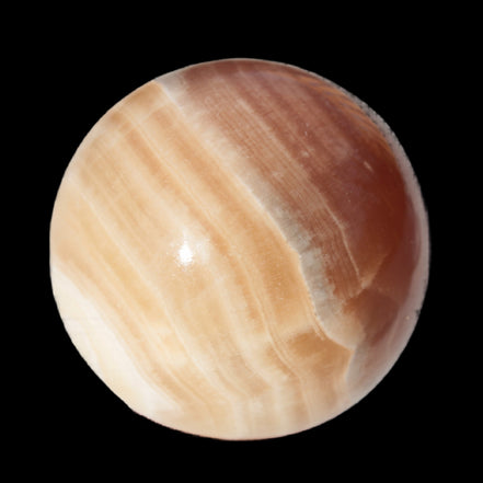 Honey Calcite sphere 55mm 177g in sunlight - Rocks and Things Store