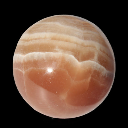 Honey Calcite sphere 55mm 177g in sunlight - Rocks and Things Store