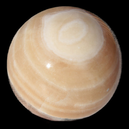 Honey Calcite sphere 55mm 177g in sunlight - Rocks and Things Store