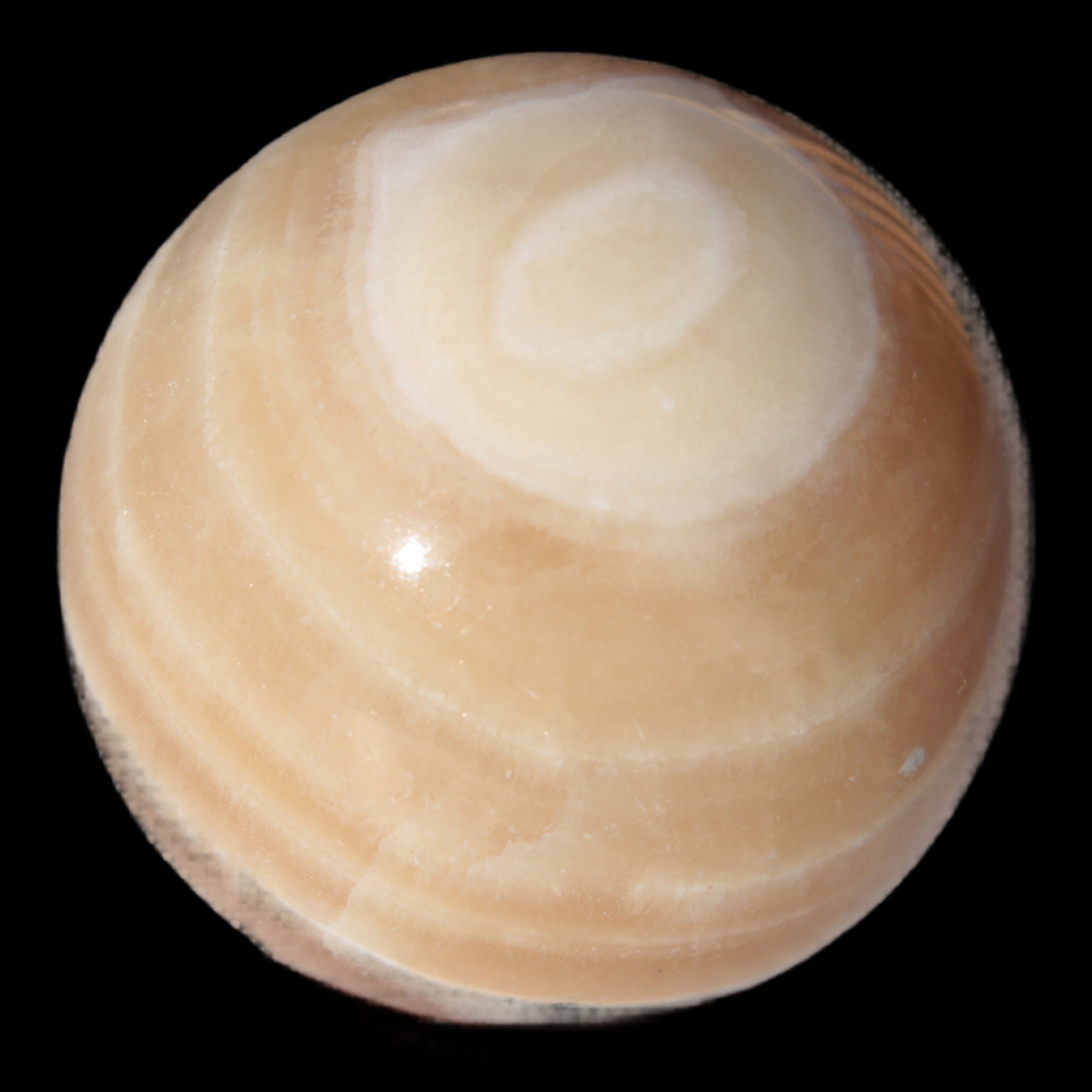 Honey Calcite sphere 55mm 177g in sunlight - Rocks and Things Store