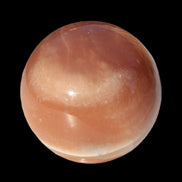 Honey Calcite sphere 55mm 177g in sunlight - Rocks and Things Store