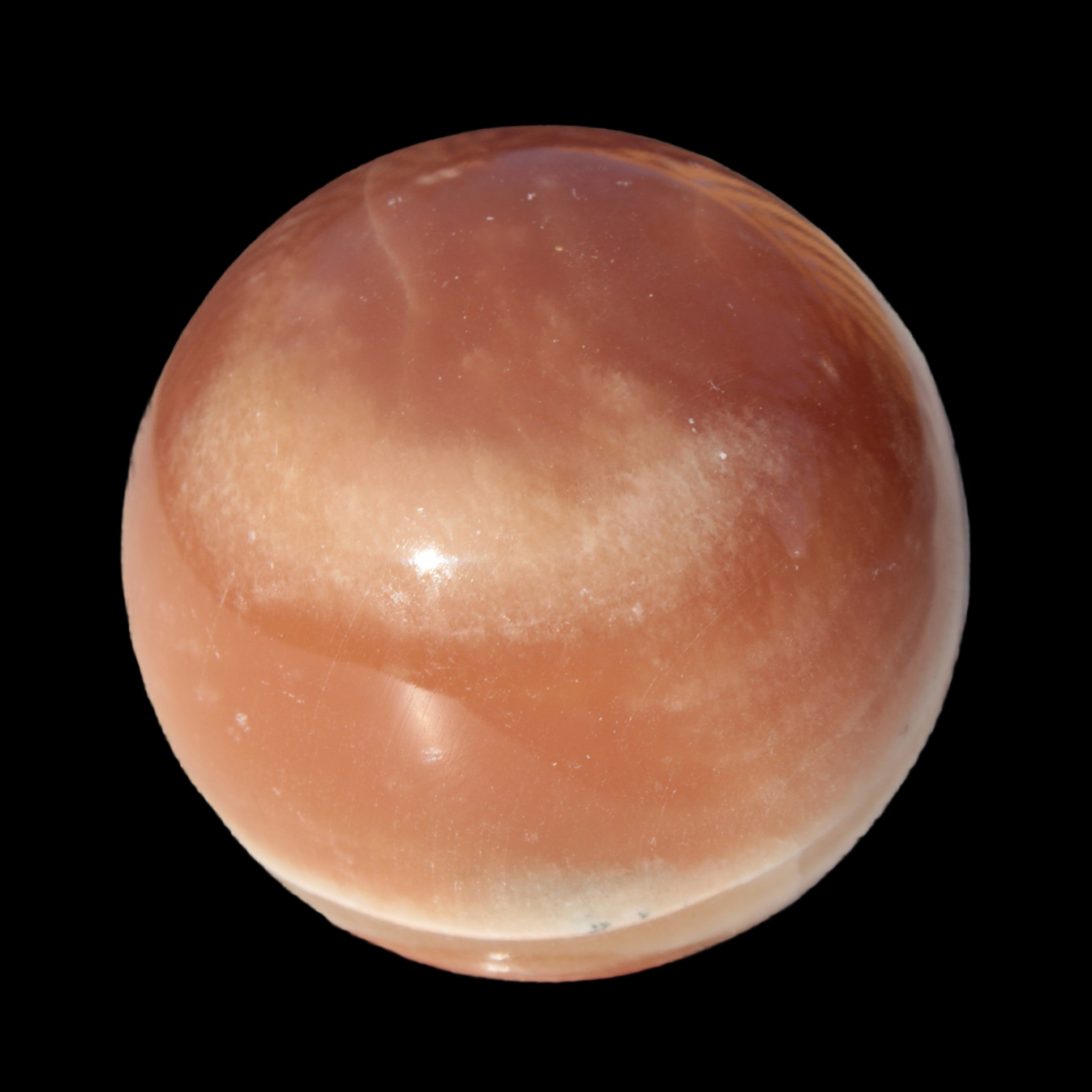 Honey Calcite sphere 55mm 177g in sunlight - Rocks and Things Store