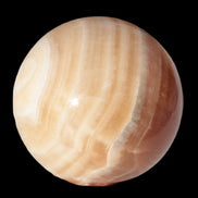 Honey Calcite sphere 55mm 177g in sunlight - Rocks and Things Store