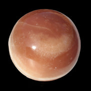 Honey Calcite sphere 55mm 177g in sunlight - Rocks and Things Store