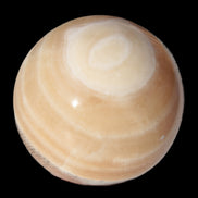 Honey Calcite sphere 55mm 177g in sunlight - Rocks and Things Store