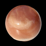 Honey Calcite sphere 55mm 177g in sunlight - Rocks and Things Store