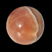 Honey Calcite sphere 55mm 177g in sunlight - Rocks and Things Store