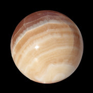Honey Calcite sphere 55mm 177g in sunlight - Rocks and Things Store