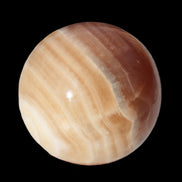 Honey Calcite sphere 55mm 177g in sunlight - Rocks and Things Store