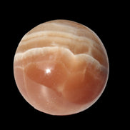 Honey Calcite sphere 55mm 177g in sunlight - Rocks and Things Store