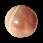 Honey Calcite sphere 55mm 177g in sunlight - Rocks and Things Store