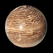 Chocolate Calcite sphere 49mm 171g in sunlight - Rocks and Things Store