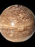 Chocolate Calcite sphere 49mm 171g in sunlight - Rocks and Things Store