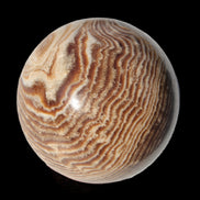 Chocolate Calcite sphere 49mm 171g in sunlight - Rocks and Things Store