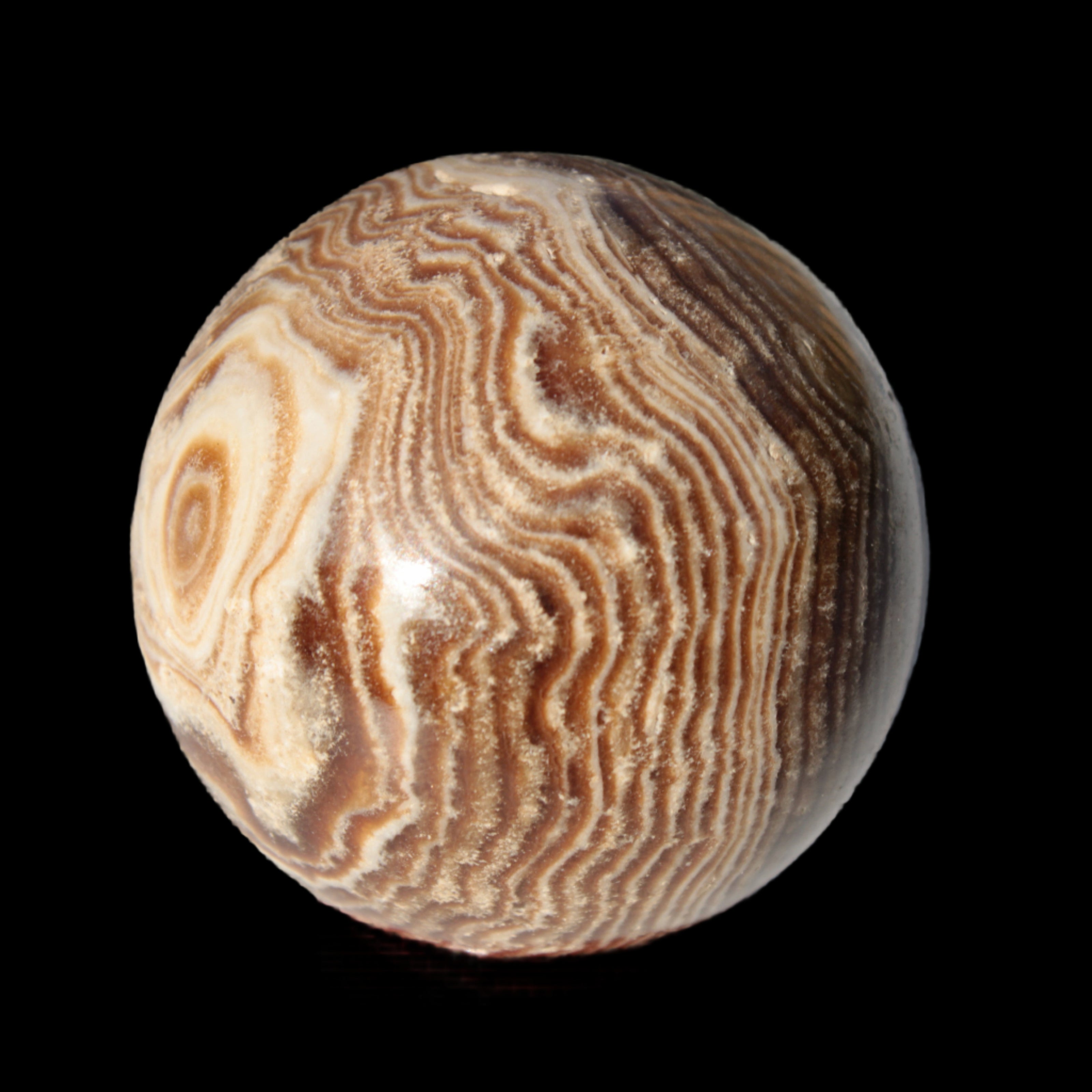Chocolate Calcite sphere 49mm 171g in sunlight - Rocks and Things Store