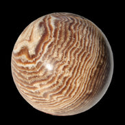 Chocolate Calcite sphere 49mm 171g in sunlight - Rocks and Things Store