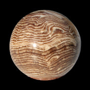 Chocolate Calcite sphere 49mm 171g in sunlight - Rocks and Things Store