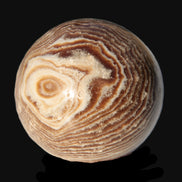 Chocolate Calcite sphere 49mm 171g in sunlight - Rocks and Things Store