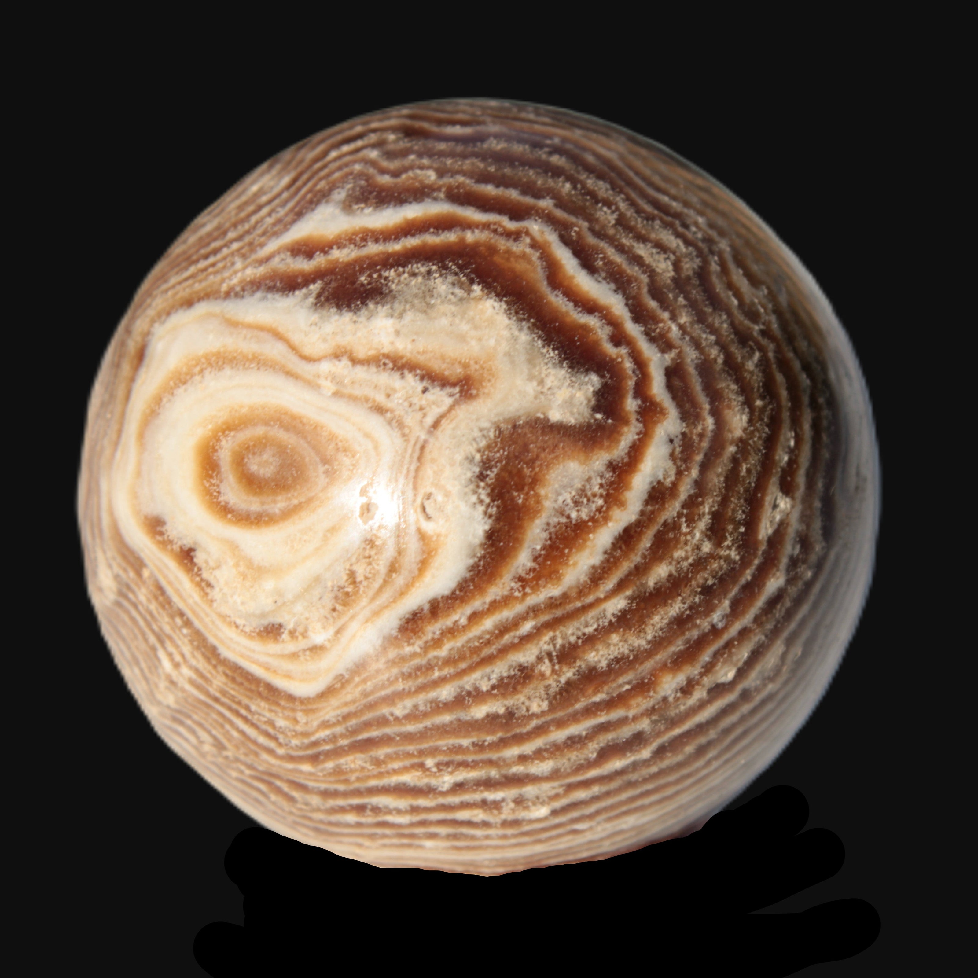 Chocolate Calcite sphere 49mm 171g in sunlight - Rocks and Things Store