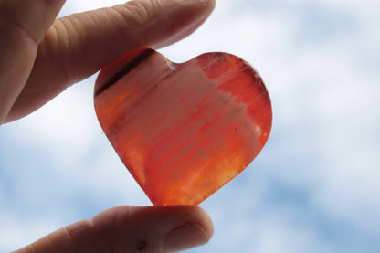 Orange Calcite hand-carved heart 57g Rocks and Things