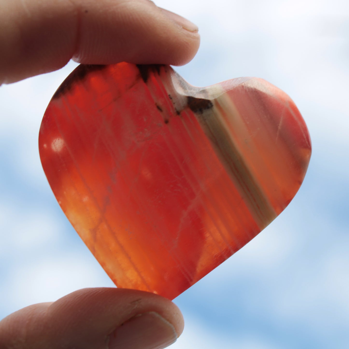 Orange Calcite hand-carved heart 57g Rocks and Things