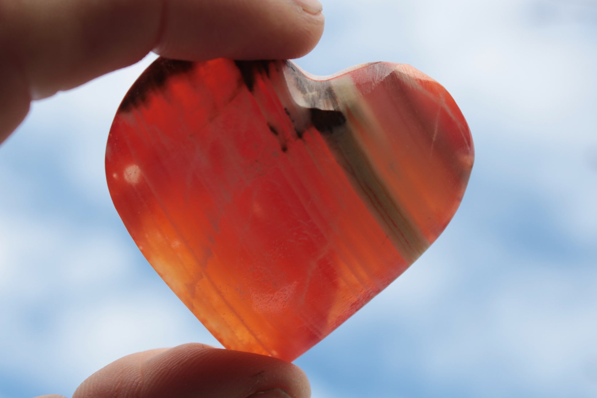 Orange Calcite hand-carved heart 57g Rocks and Things